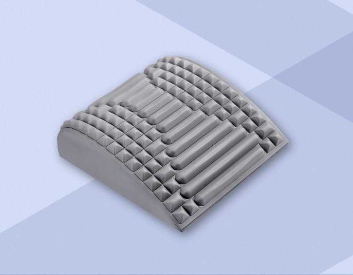 Coussin lombaire ergonomique gris utilisé pour confort prolongé et posture saine