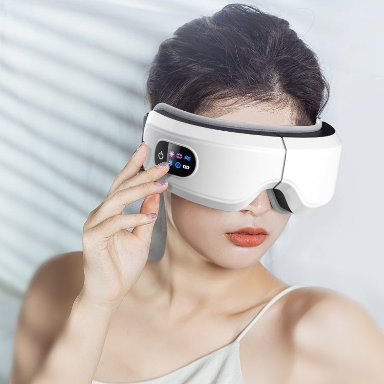 Masseur ocular branco Reprogrammer Boutique com pressão de ar, vibração e calor para alívio de tensões.